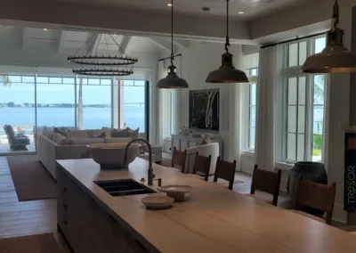 A kitchen with a large island and a couch.